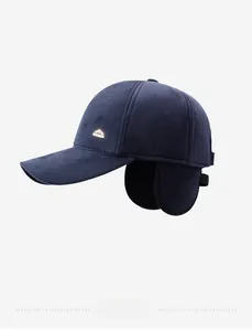 Detail of navy blue winter baseball cap featuring ear flaps and herringbone texture fabric