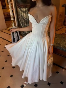 Elegant white strapless midi dress with corset bodice and pleated satin skirt for women