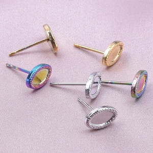 Close-up of heart-shaped 304 stainless steel earring bases in gold, silver and rainbow finish