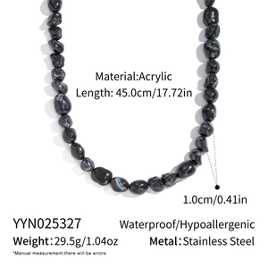 Detail view of irregular black acrylic beads necklace with size and material specifications