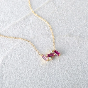 S925 silver square pink-purple gemstone pendant necklace on white textured marble surface