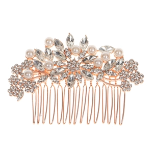Detail view of rose gold bridal hair comb with elegant faux pearls and crystal rhinestones