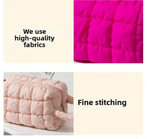 Detailed view of high-quality quilted fabric and fine stitching on the makeup bag