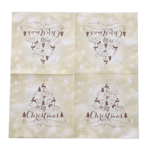 Detailed view of Merry Christmas napkins with gold reindeer tree and snowflake print