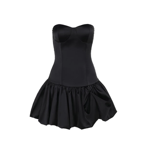 Detail of black strapless mini dress with corset bodice and satin bubble hem skirt