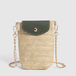 Straw cell phone crossbody bag with dark green leather flap and gold chain strap