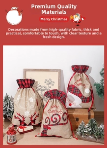 Detail of Christmas burlap drawstring gift bags with Santa and reindeer patterns