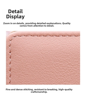 Detail shot of pink lychee textured leather wallet with precise stitching craftsmanship