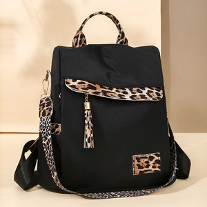 Lightweight black oxford backpack for women with leopard print accents and gold zippers