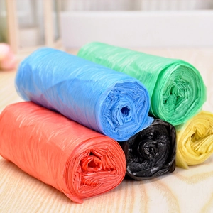 Five rolls of colorful point-break plastic garbage bags in red, blue, green, black and yellow