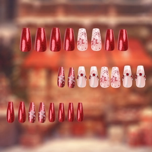 Christmas snowflake press-on nails with red glitter, pearls and coffin shape design