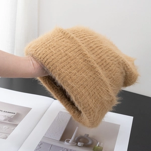 Close-up of warm camel fluffy knit hat showing soft fuzzy texture and thick warm material