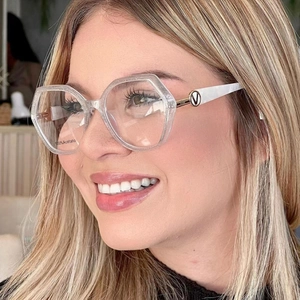 Detail shot of polygon acetate glasses with glitter finish and metallic logo on the temple