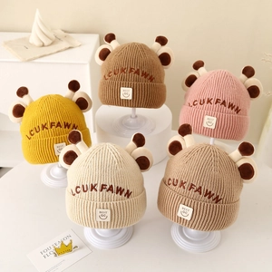 Knitted winter beanies for kids featuring cute cartoon giraffe antlers in five colors