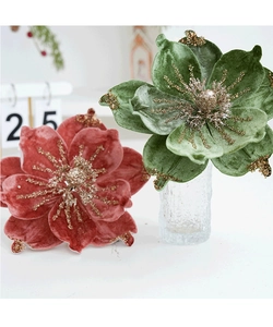 Close-up of velvet Christmas flowers with gold glitter edges in red and green colors