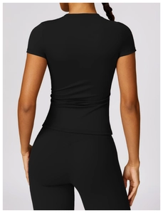 Rear view of tight-fitting black quick-dry yoga t-shirt showing slim fit and back seams