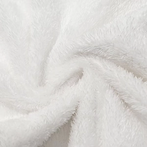 Macro shot of soft white plush fabric texture and fluffy fibers for women's hooded jacket