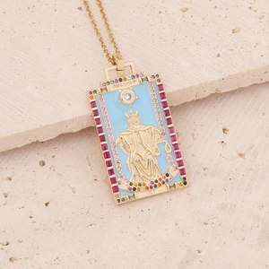 Macro view of Justice tarot pendant with blue enamel and colorful gemstones