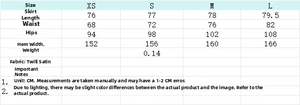 Tableau des tailles pour jupe en satin à pois avec mesures de longueur et taille
