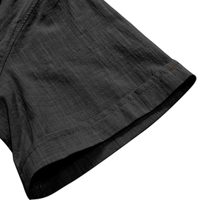 Detailed macro view of sleeve stitching on dark grey cotton linen beach shirt