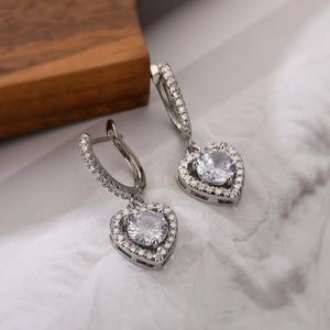 Sparkling silver heart drop earrings with round center stone and pave zircon accents