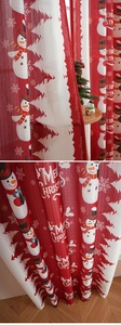 Detailed view of snowman and Christmas tree prints on high-quality festive blackout curtains
