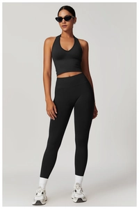 Detailed full-body view of high-waist black yoga set with halter v-neck sports bra