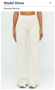 Detailed front view of high-waisted oatmeal apricot wide-leg pants with white stitching