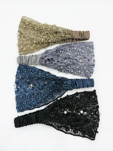 Detail of four lace headbands with pearls and rhinestones in champagne, grey, blue, and black