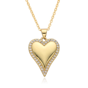 Detail of a 14K gold-plated heart pendant with sparkling crystals and a fine metal chain