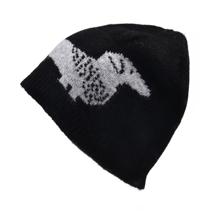Detailed view of the thick elastic ribbed knit texture on the black beanie edge
