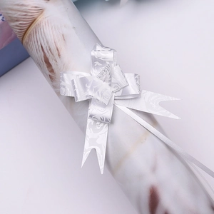 Silver pull bow ribbon with rose pattern for gift wrapping and holiday decoration