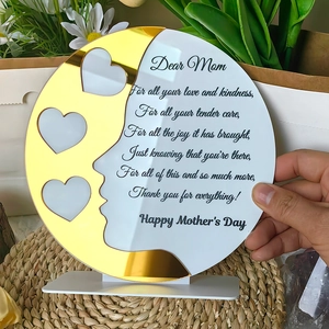 Detail of round acrylic Mother's Day frame with gold mirror faces and heart photo slots