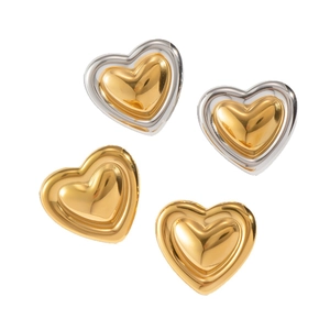 Elegant vintage heart-shaped stud earrings in gold and silver-tone finishes on white