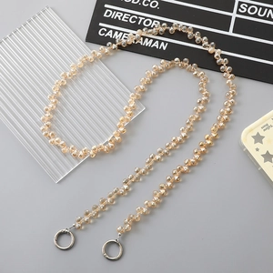 Detail of champagne crystal beaded strap with silver spring rings for handbags