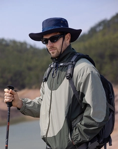 Close-up of navy blue sun hat with breathable mesh and adjustable strap for hiking