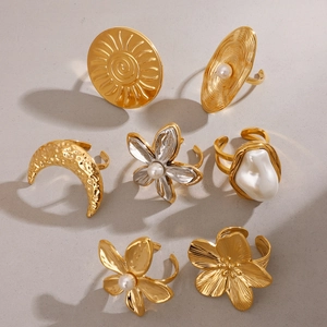 Vintage gold stainless steel rings set featuring sun, moon, and pearl floral designs