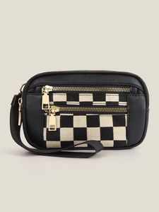 Detail of dual zipper compartments and checkered fabric on compact wristlet bag