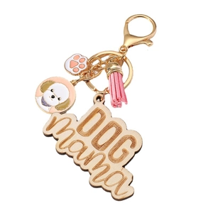 Dog Mama wooden keychain with pink tassel, paw charm and gold-tone lobster clasp