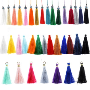 Detailed assortment of colorful tassel end caps and jewelry findings in various vibrant hues