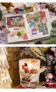Christmas themed stickers used for journaling and candle decoration in a cozy home setting