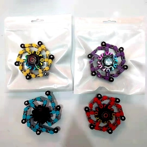 Detailed set of four colorful mechanical fidget spinners in yellow, purple, blue, and red