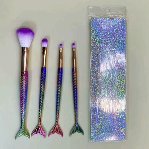 4pcs mermaid makeup brush set with gradient rainbow handles and holographic glitter bag