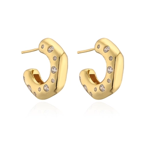 Elegant gold geometric C-shaped hoop earrings with sparkling cubic zirconia on white background