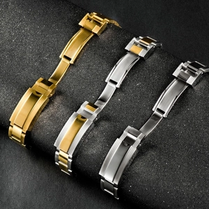 Close-up of gold, silver and two-tone steel link bracelets for men's watches