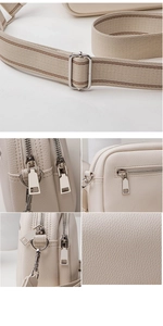 Macro shot of off-white lychee pattern leather and striped woven shoulder strap detail