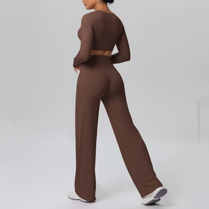 Detail view of chocolate brown two-piece yoga set with long sleeves and wide-leg pants
