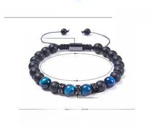 Detail of 8mm black matte and blue tiger eye beaded bracelet with adjustable cord