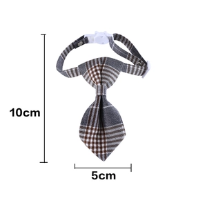 Detail view of the gray and brown plaid pet necktie with adjustable white plastic buckle
