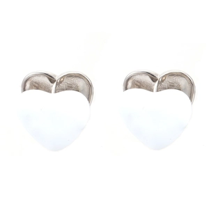 Detail of small heart stud earrings featuring white enamel and silver metal edges